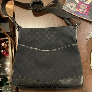 Black Gucci messenger bag